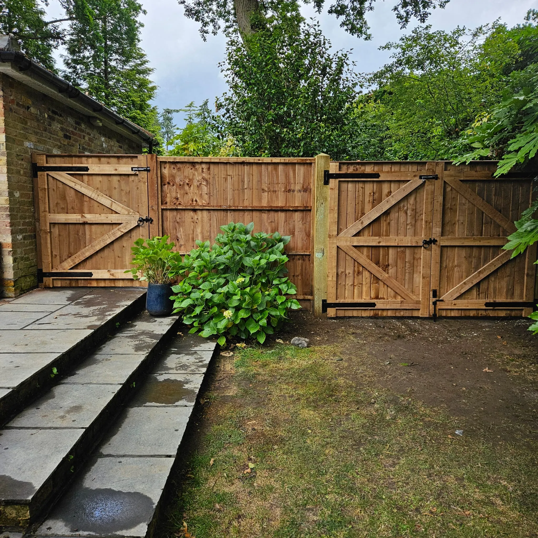 stairs with fence and greenery